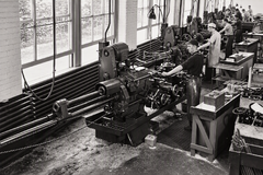 Lathe Department Craftsmen Machinists operating lathes along the window bay, Ames Street plant.