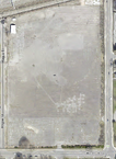 Cleared Site (2021 Aerial Imagery) Present-day aerial view of the cleared 95 Ames Street parcel, where outlines of the former factory foundations remain visible in the soil.
