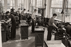 Machining & Tooling Benchwork Craftsman working with precision gauges and tooling at the Ames Street plant.